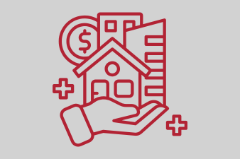 Hand hält ein Haus-Symbol, umgeben von Geldsymbolen und Gebäuden.